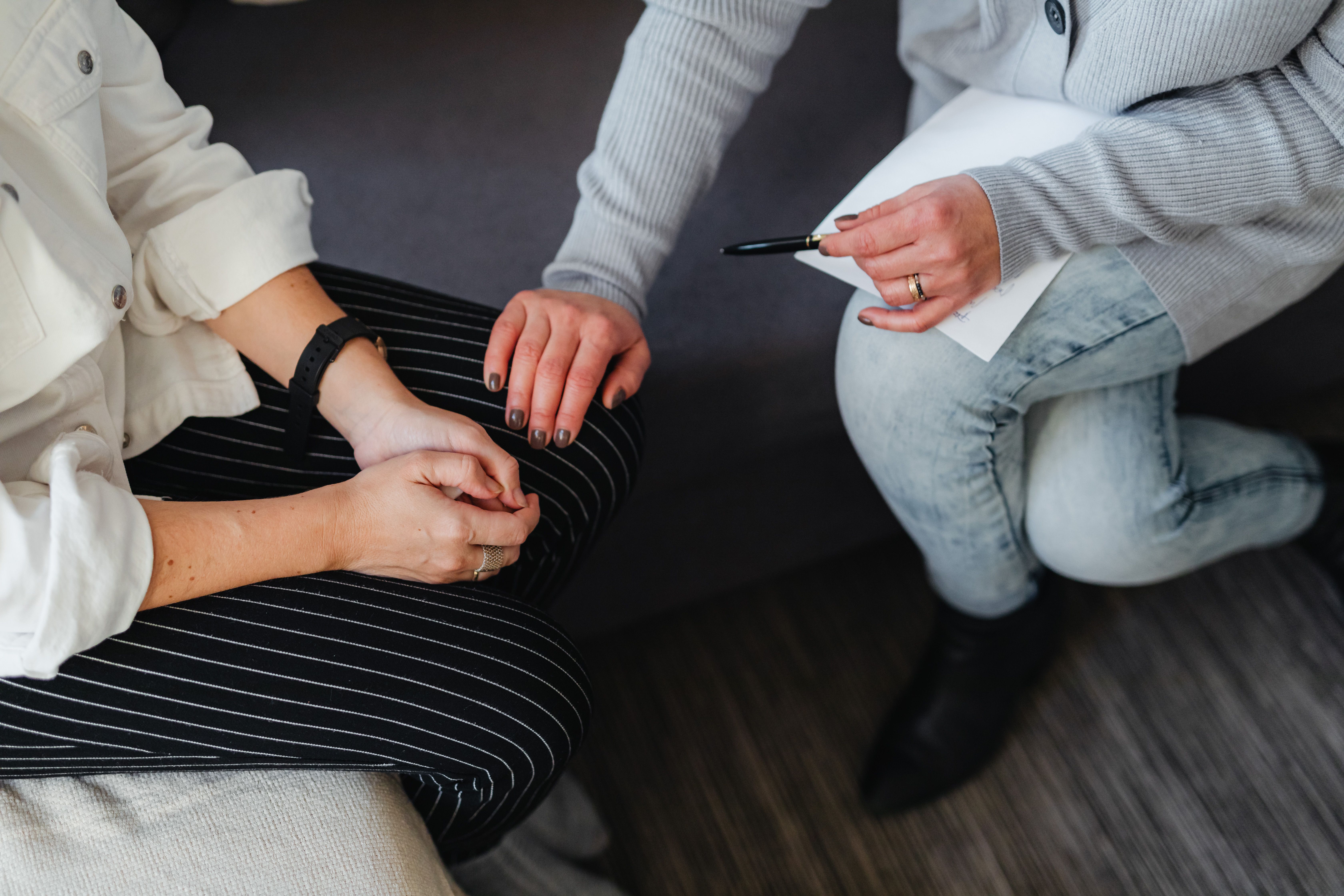 A supportive counseling session showing comfort and mental health care for disaster survivors